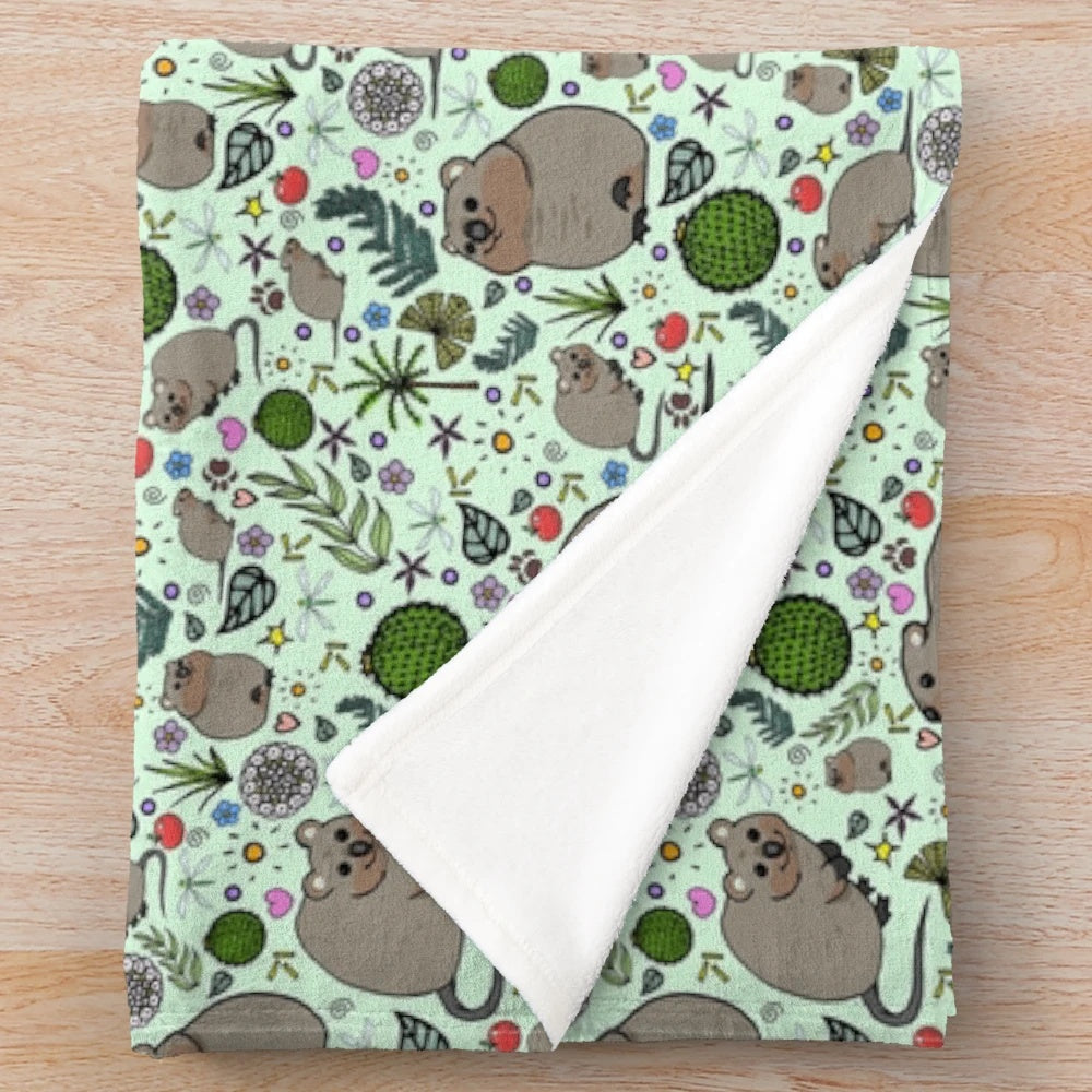 Soft and cozy plush blanket featuring a cute green quokka pattern