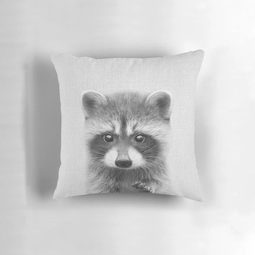 Soft, modern accent pillow featuring a cute black and white raccoon portrait