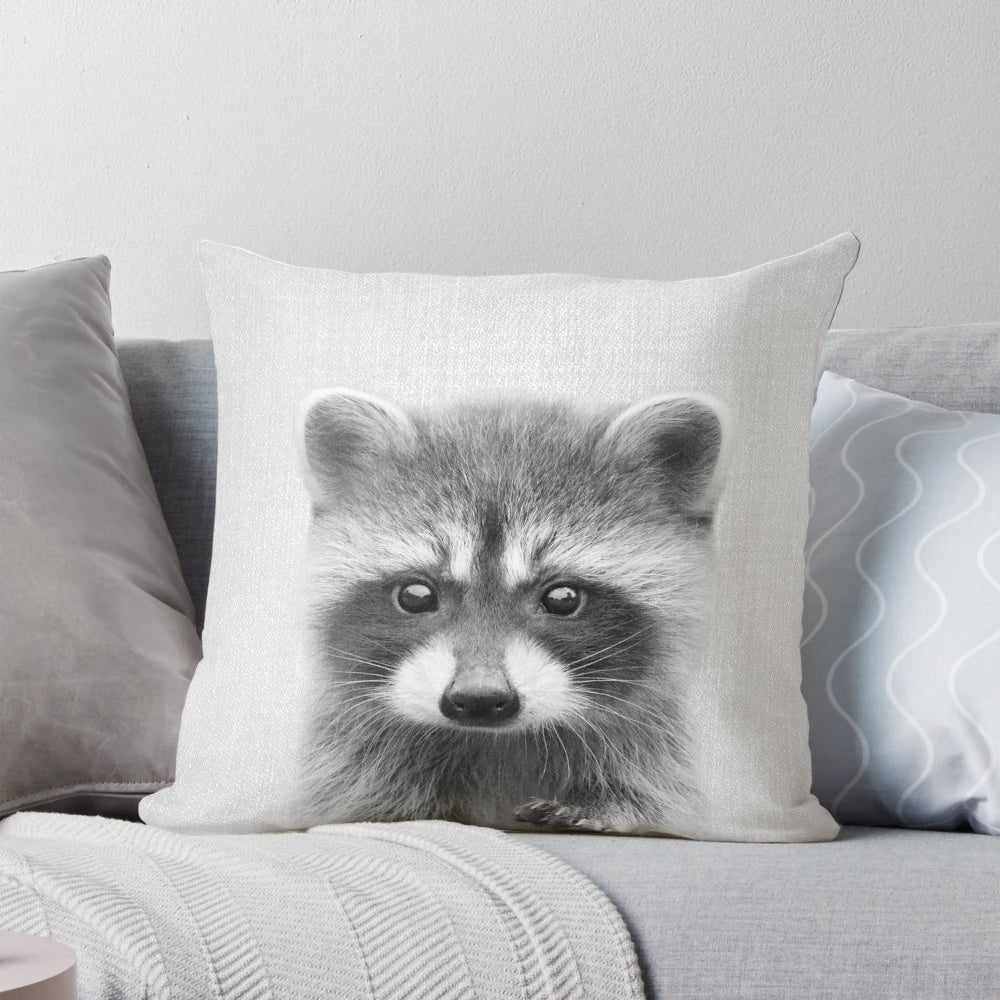 Soft, modern accent pillow featuring a cute black and white raccoon portrait