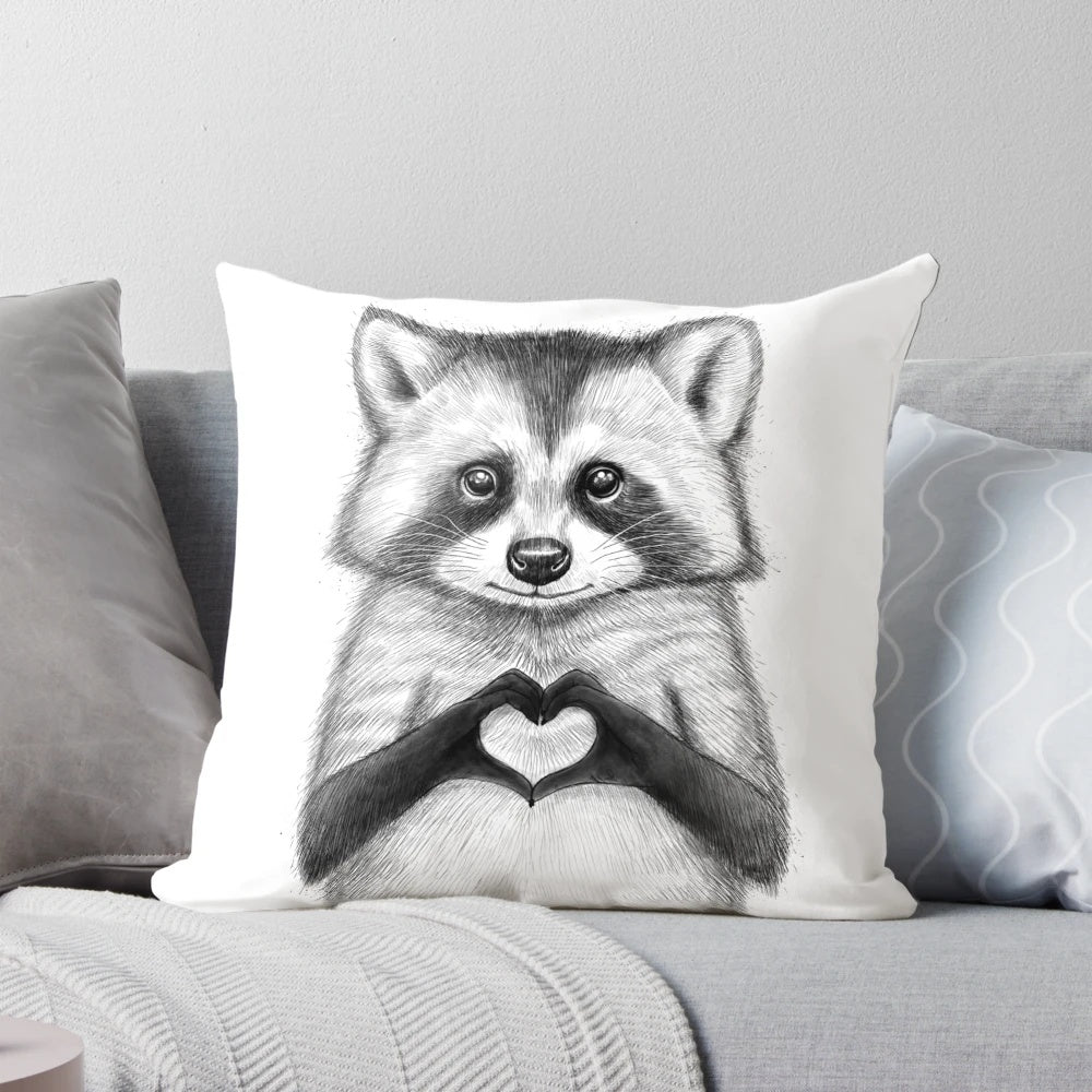 Soft, plush pillow featuring a cute, black and white raccoon design with a heart shape