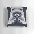 Soft, plush raccoon-shaped pillow with a heart-shaped face and whimsical, hand-drawn illustration