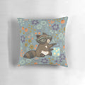 A fluffy pillow featuring a cute and funny cartoon raccoon collecting flowers and leaves