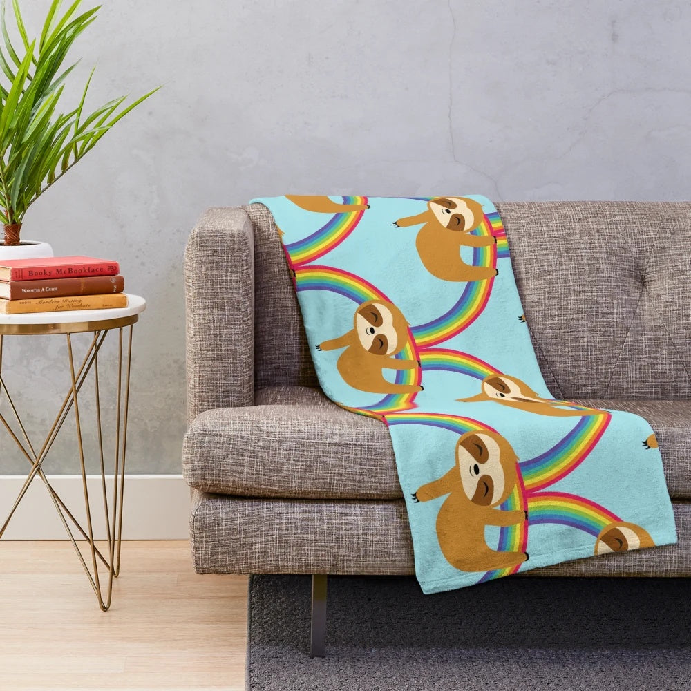 Cute sloth hanging on a rainbow, plush and cozy blanket