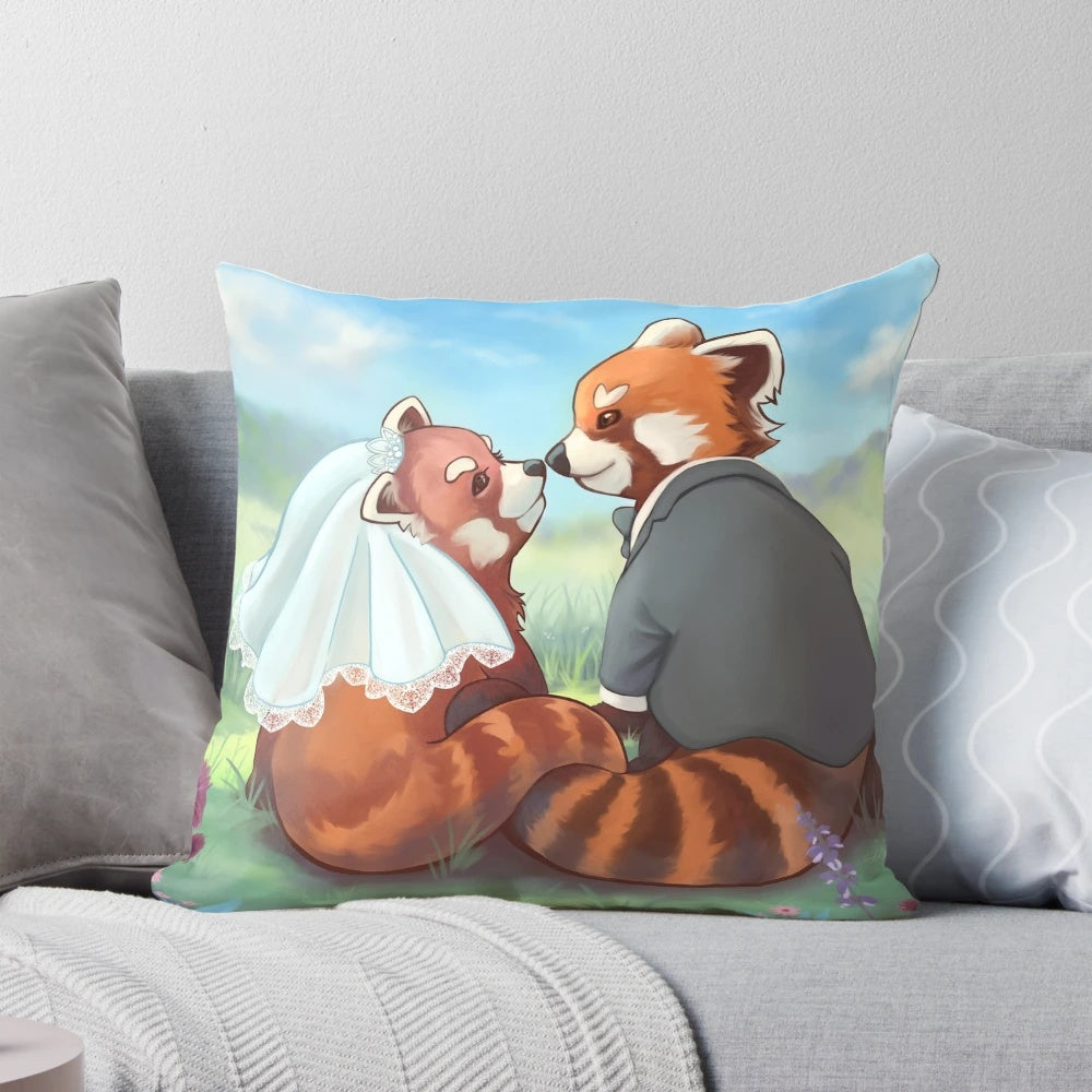 Cute red panda couple cuddling on a decorative pillow