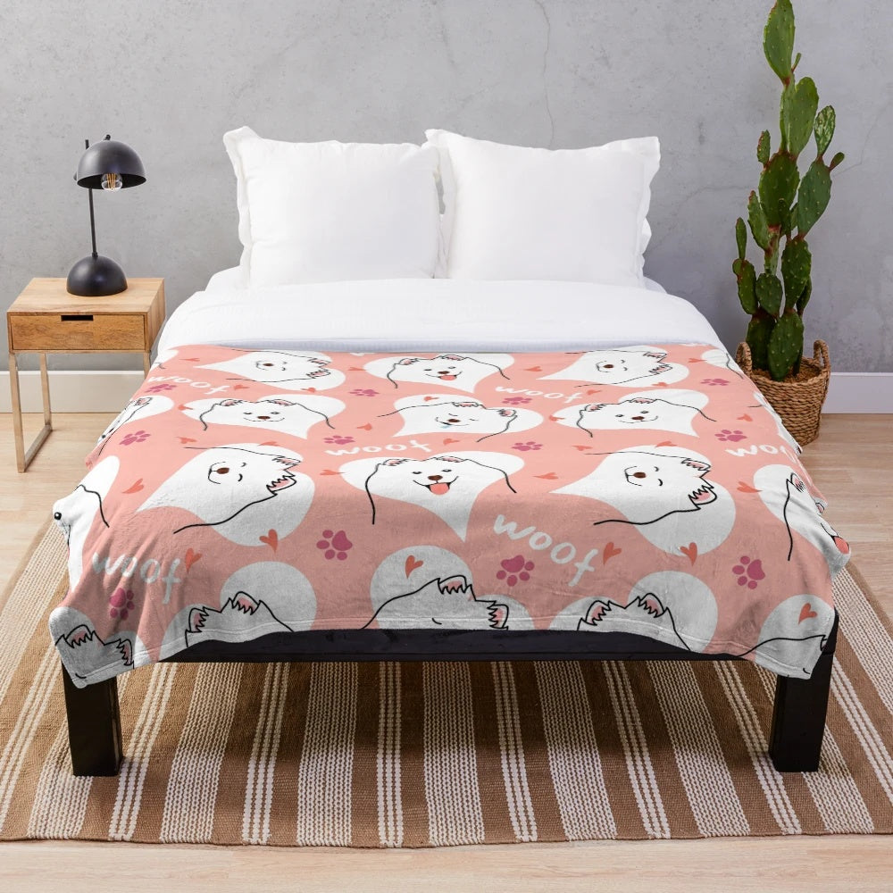 Soft and cuddly pink plush blanket featuring a cute Samoyed dog emoji design