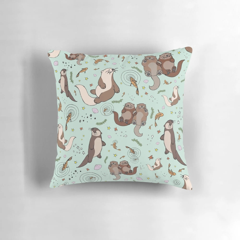 Soft, plush pillow featuring a playful sea otter design, perfect for nature and animal lovers.