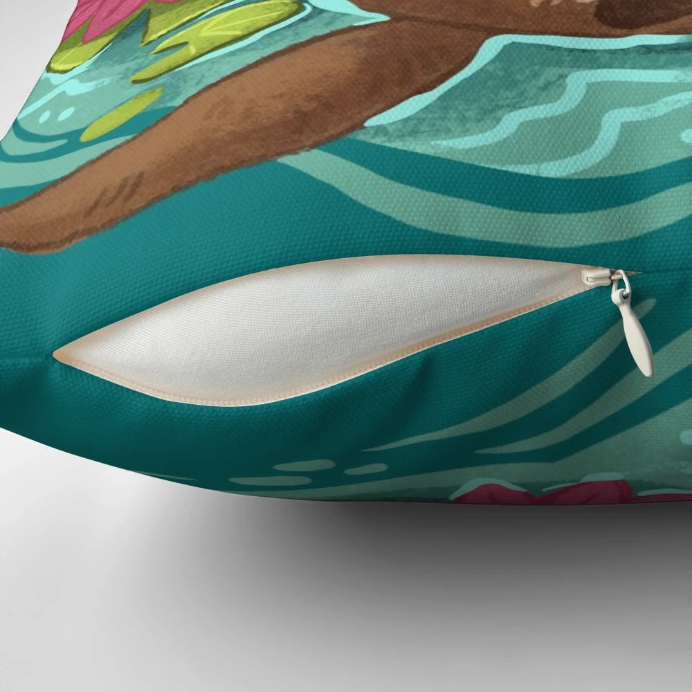 A soft, plush pillow featuring a happy sea otter surrounded by lotus flowers and pond elements.