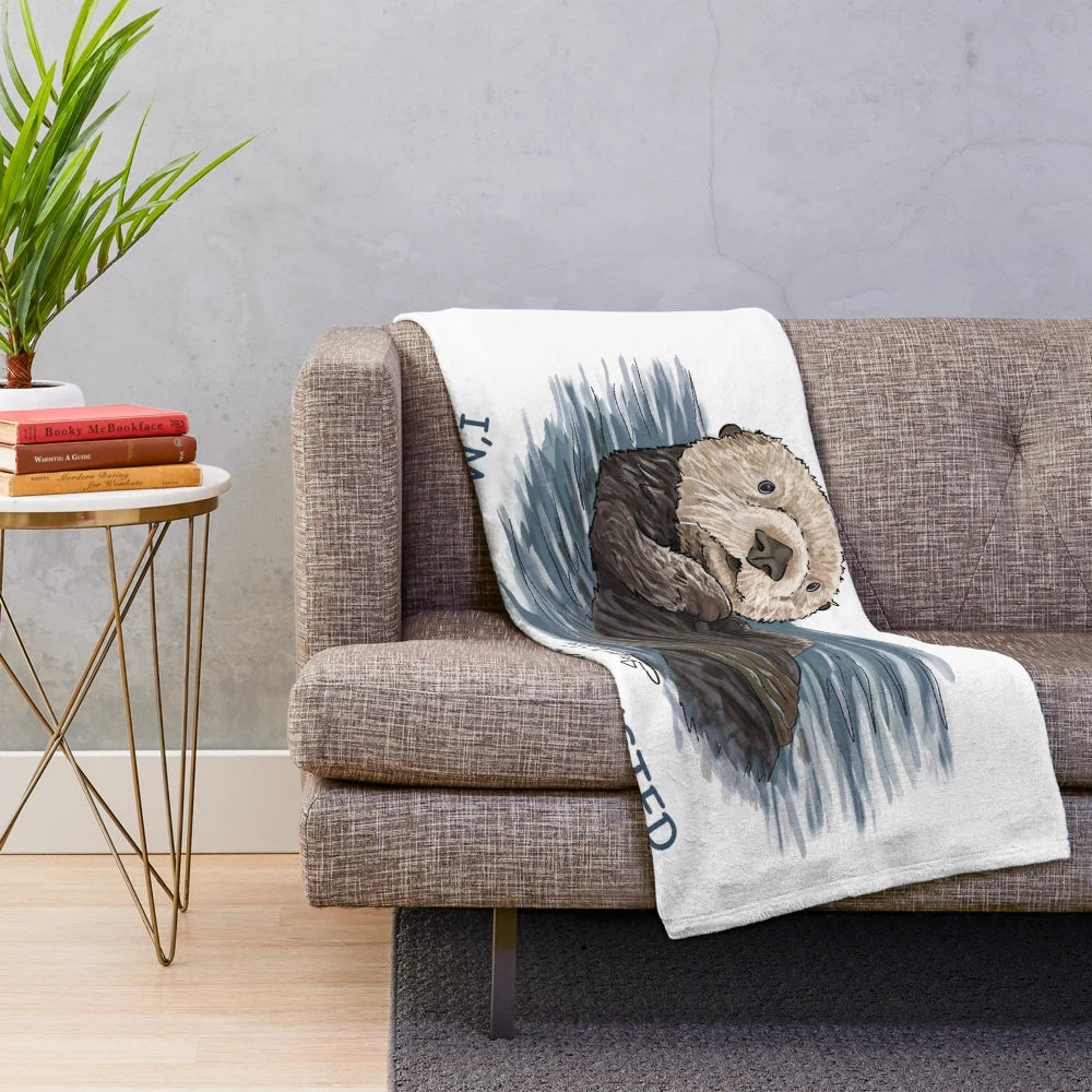 Soft, cozy plush blanket featuring a hand-drawn sea otter sketch design