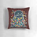 Cute and funny seal wearing a santa hat on a Christmas tree-shaped pillow