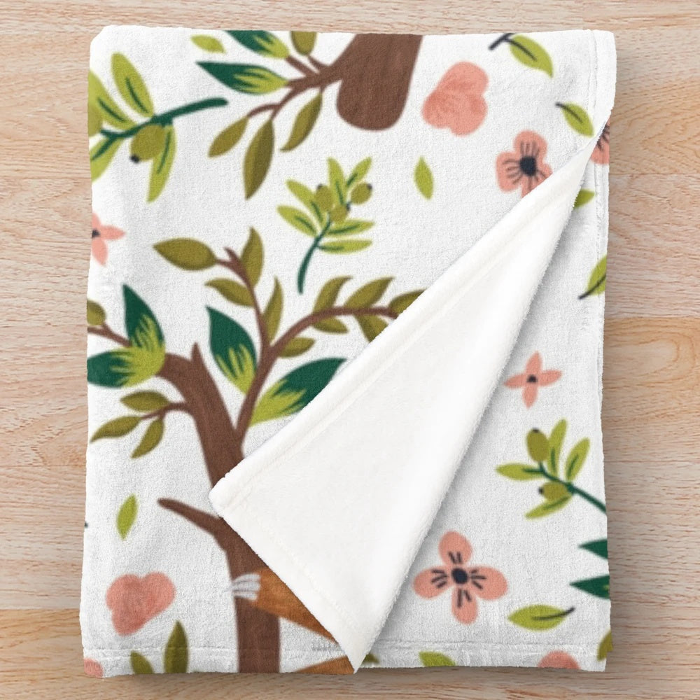 Soft and cuddly sloth plush blanket featuring a cute, cartoon-style sloth design