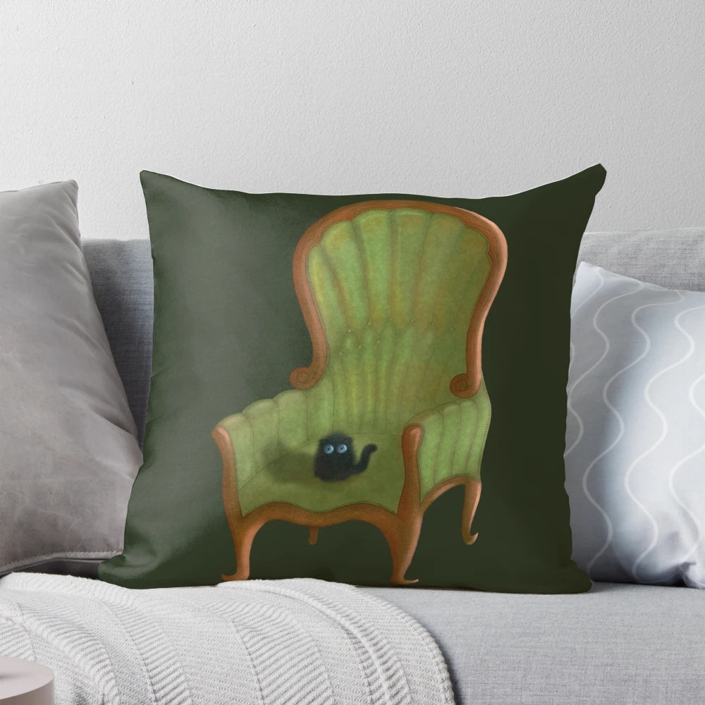 Cute small cat sitting on a pink chair pillow