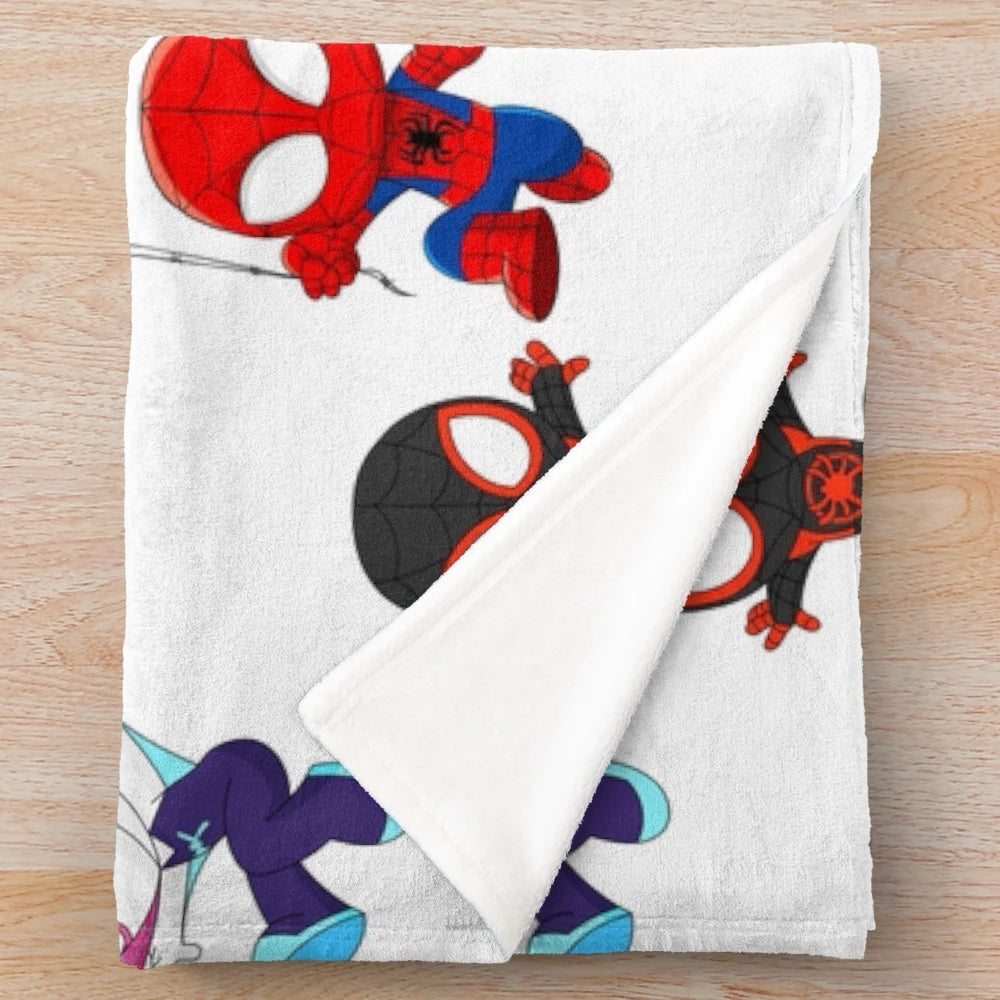 Plush blanket featuring a variety of spider-themed designs, including black spidey and cute cartoon spiders