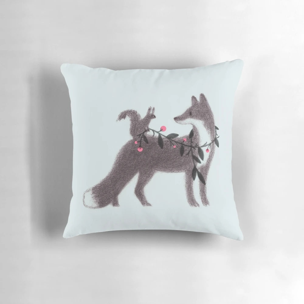 Illustrated pillow featuring a squirrel and fox in a sweet, nature-inspired design.
