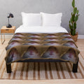 Cozy plush blanket featuring a staring hamster design