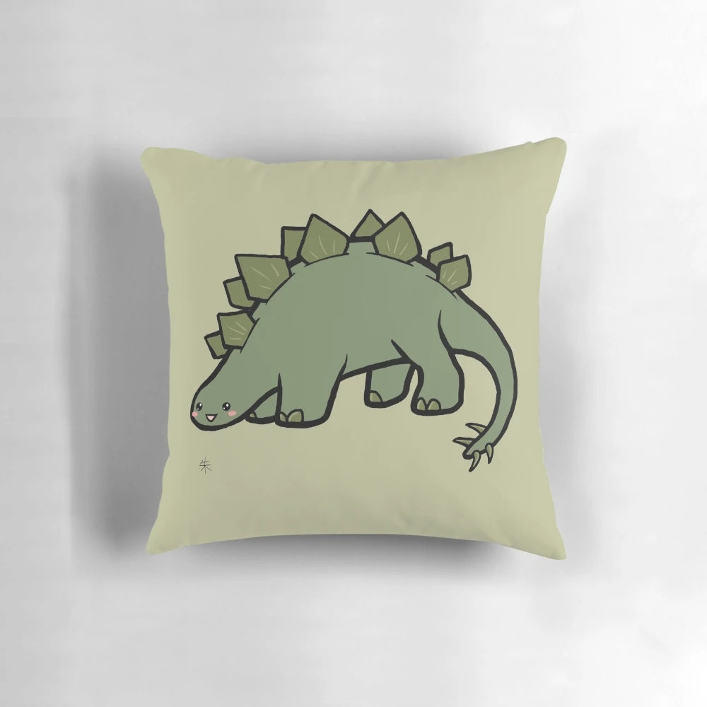 Image of a green stegosaurus-shaped plush pillow with a cute, chibi-style design