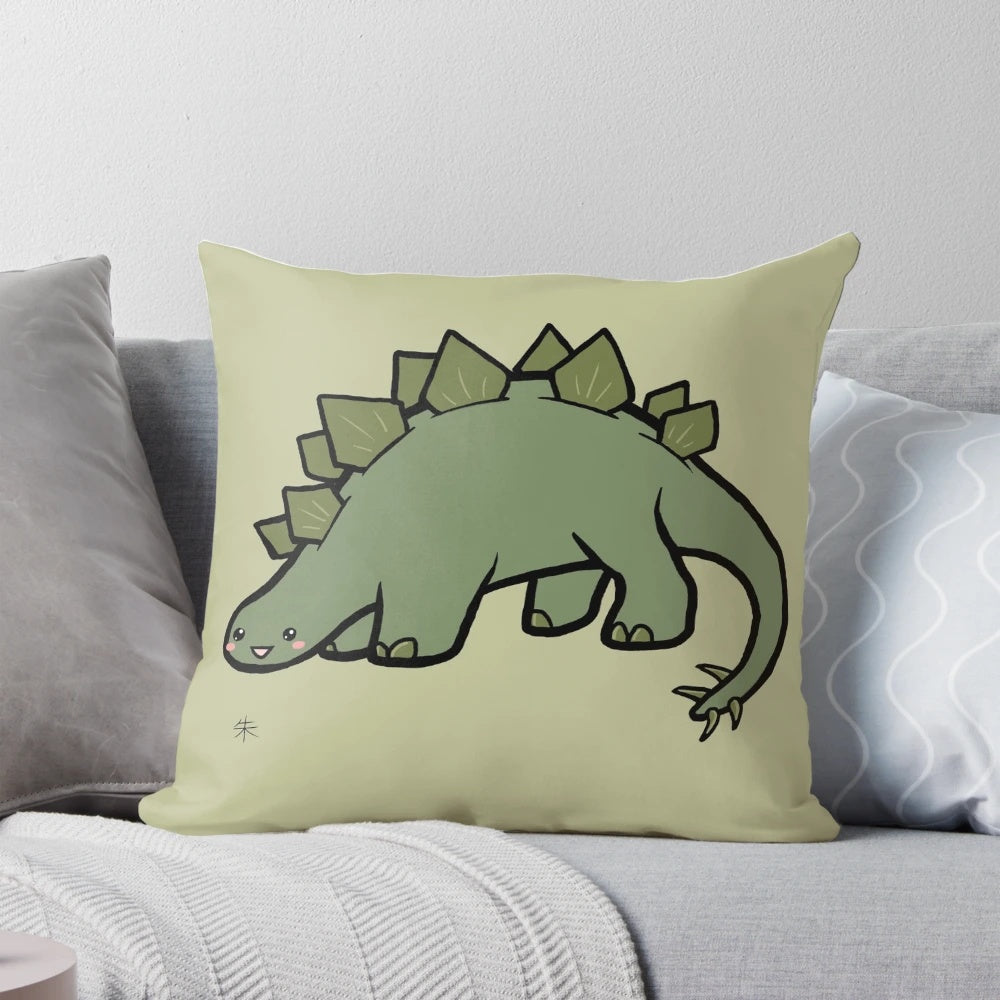 Image of a green stegosaurus-shaped plush pillow with a cute, chibi-style design