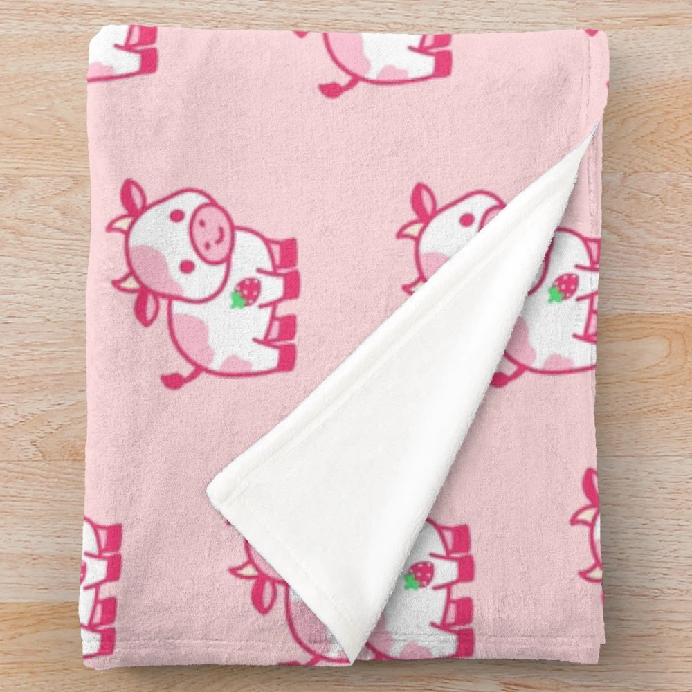 Soft and snuggly strawberry cow plush blanket