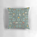 Whimsical illustration of colorful, cartoon-style Swedish folk cats on a decorative pillow.