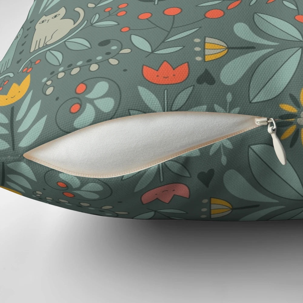 Whimsical illustration of colorful, cartoon-style Swedish folk cats on a decorative pillow.