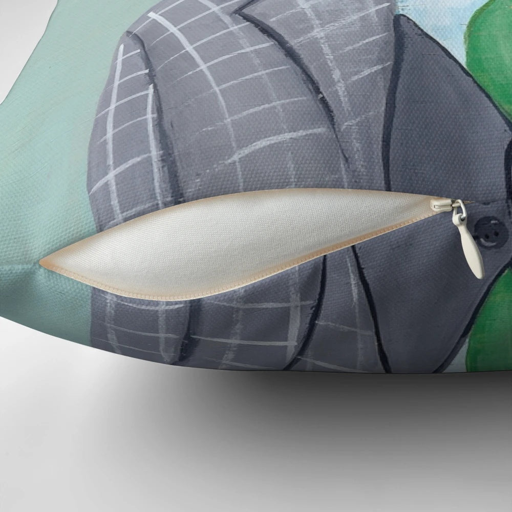 Tiarnan the Tabby Cat Pillow wearing a green shamrock suit and clover accessories