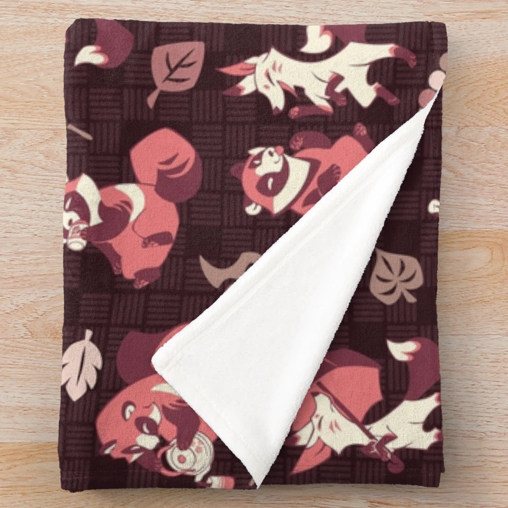 Tanuki and kitsune inspired plush blanket with a cozy and soft design