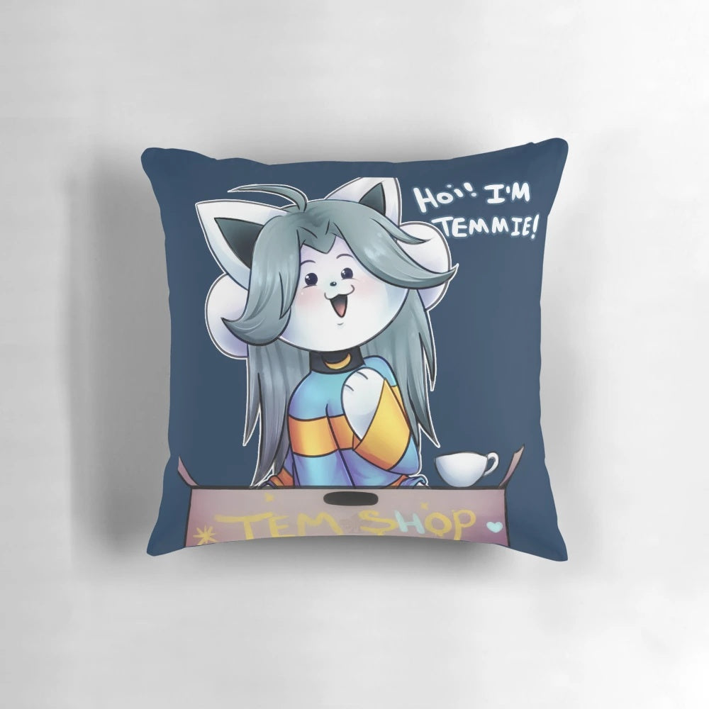 A fluffy, white pillow featuring the iconic Temmie character from the game Undertale.