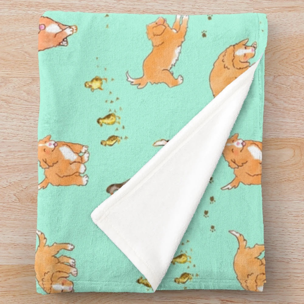 Toller puppy and duckling playing on a mint plush blanket with a sketch pattern design
