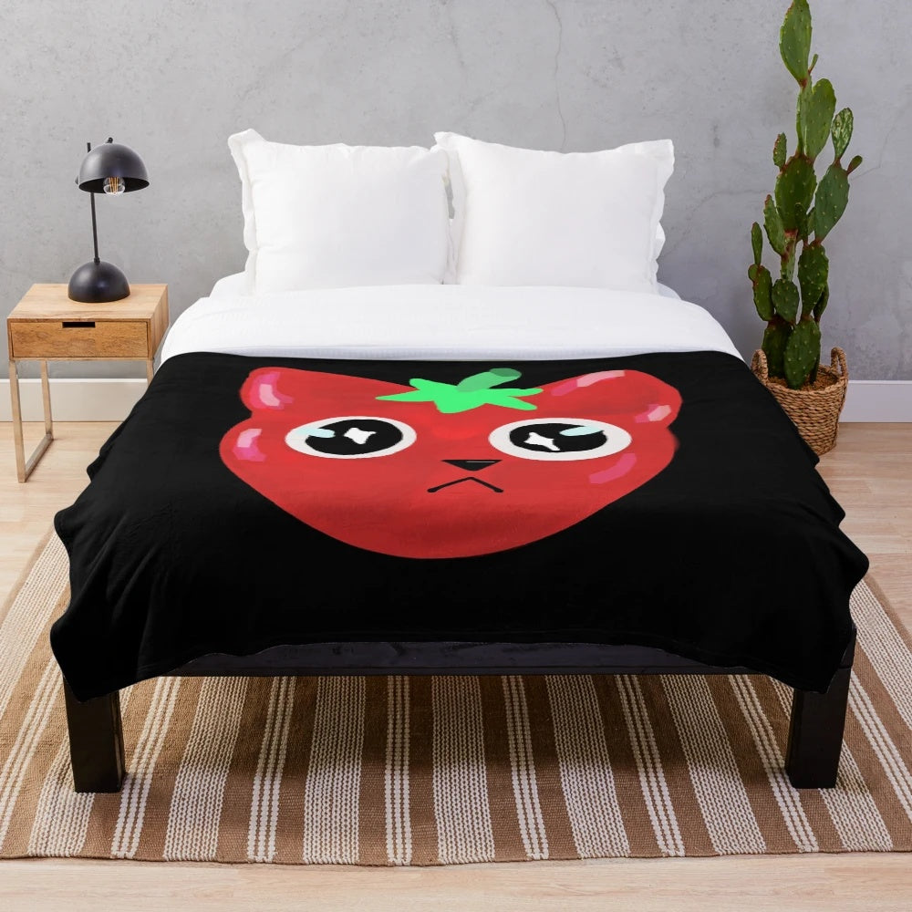 A cozy and cuddly plush blanket featuring an adorable tomato-shaped cat design