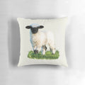 A soft, plush pillow featuring an adorable Valais Blacknose sheep lamb in a beautiful natural meadow setting.