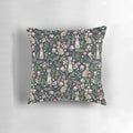 Beautifully designed pillow featuring a whimsical watercolor illustration of a cute blue rabbit surrounded by floral and nature elements.