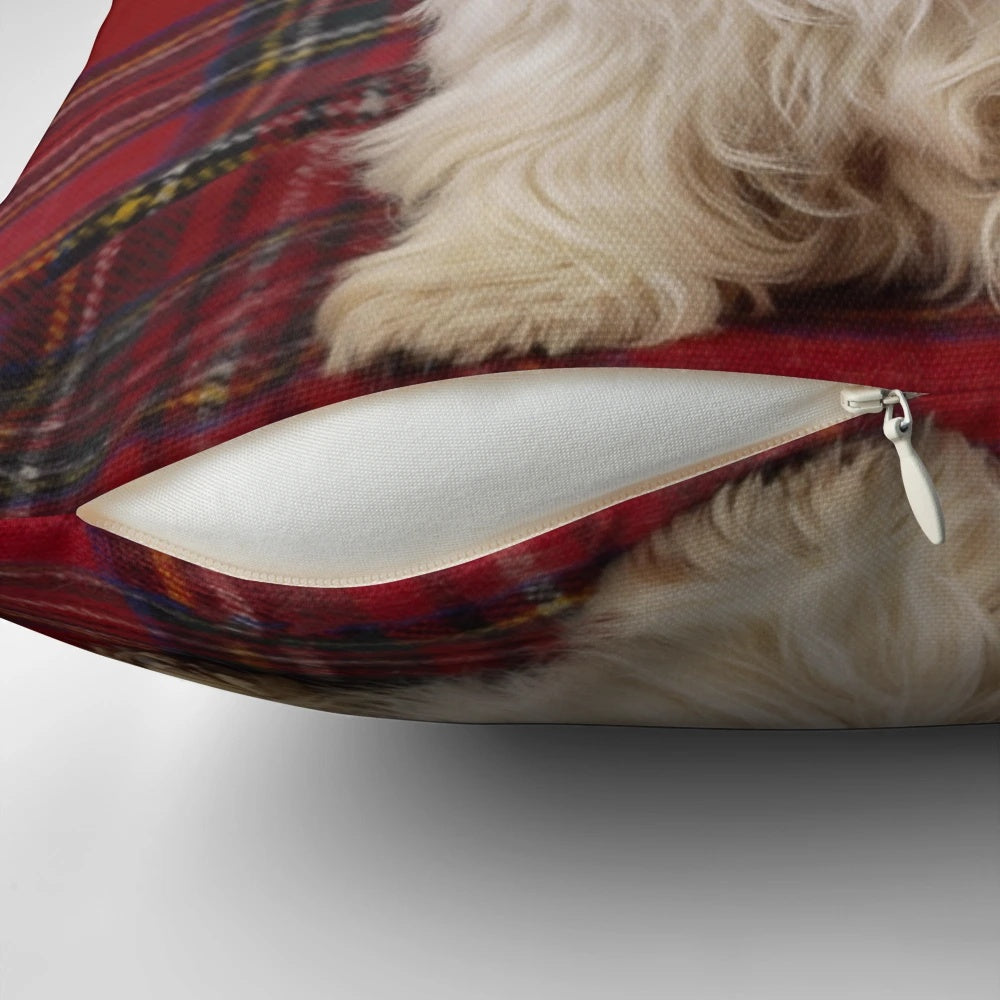 Adorable West Highland Terrier dog sitting on a Scotch plaid pattern pillow