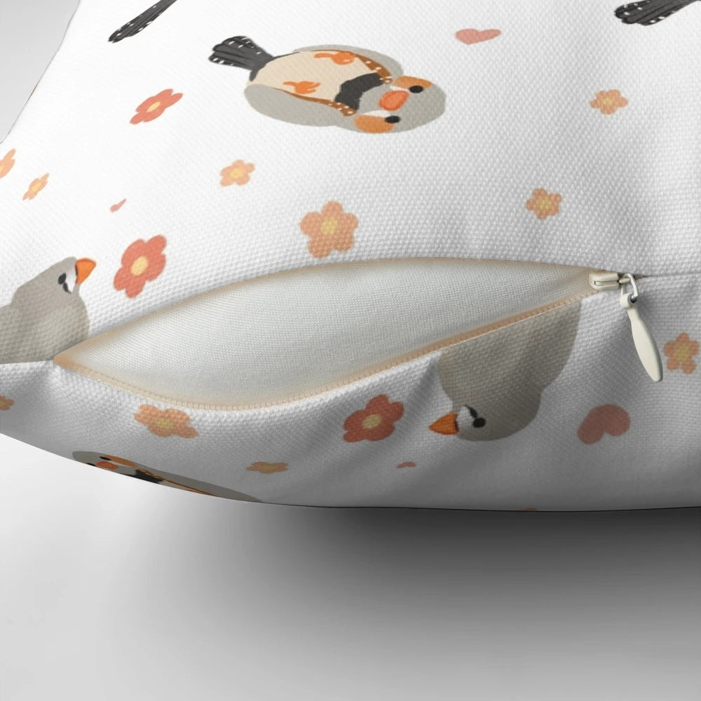 Pillow featuring a colorful pattern of zebra finches and flowers