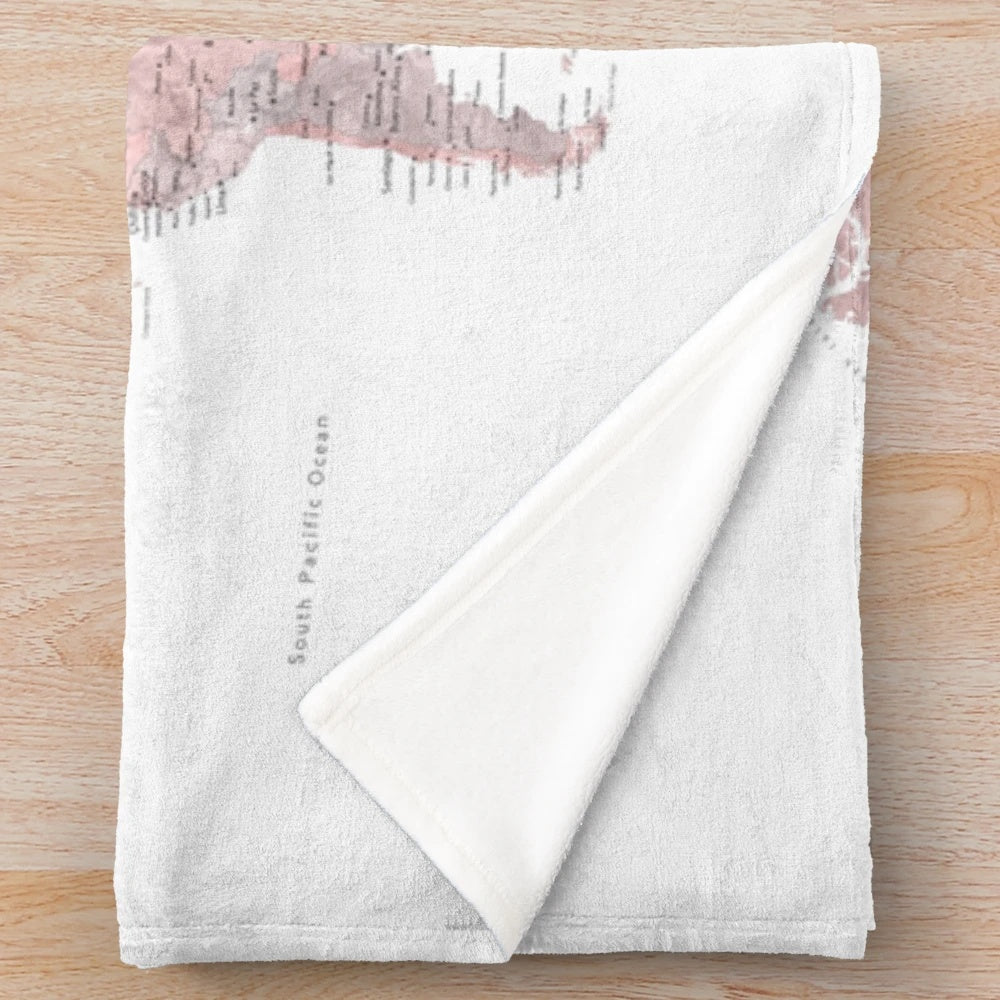 Detailed world map design on a cozy pink and grey plush blanket