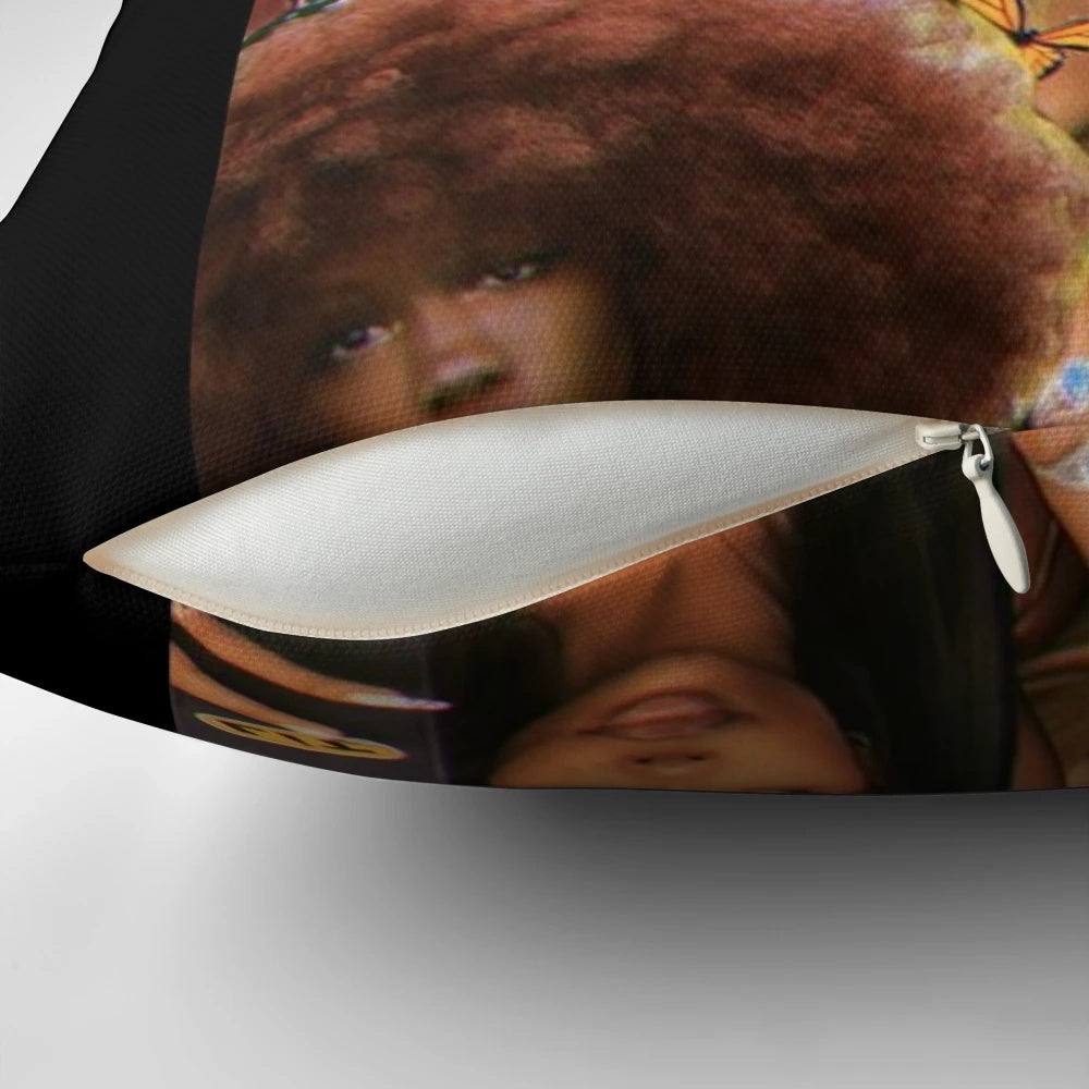 A collage of SZA, the R&B singer, printed on a soft, cozy pillow.