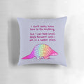 A soft, rainbow-colored pangolin pillow with a message of self-love and mental health affirmations.