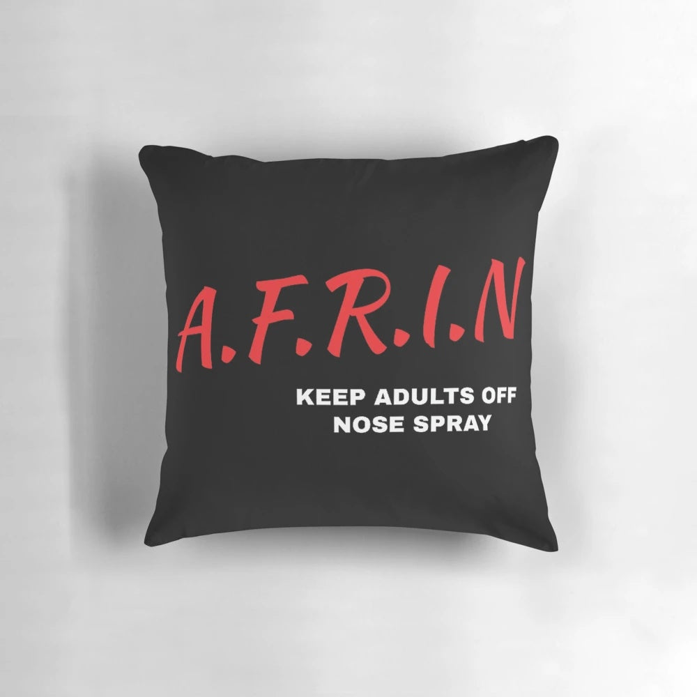 AFRIN Nasal Spray bottle on a soft, comfortable pillow