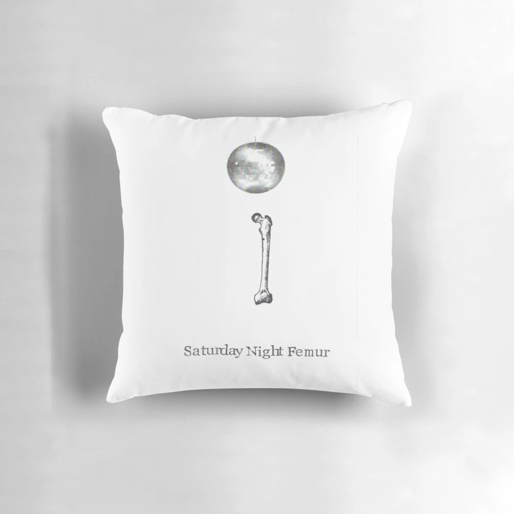 Saturday Night Femur Pillow - An amusing medical-themed accent piece featuring a femur bone design