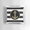 Black and white striped pillow with a gold anchor design, perfect for coastal or modern home decor.