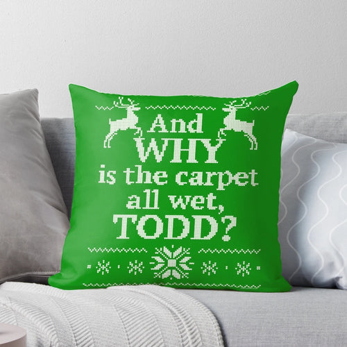 A vintage-style decorative pillow featuring the iconic "And Why Is the Carpet All Wet, Todd?" quote from the beloved Christmas comedy movie "Christmas Vacation".