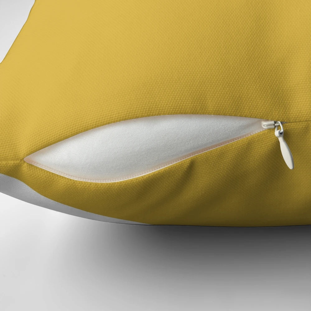 Angled color block pillow with navy blue, light mustard yellow, and white geometric design