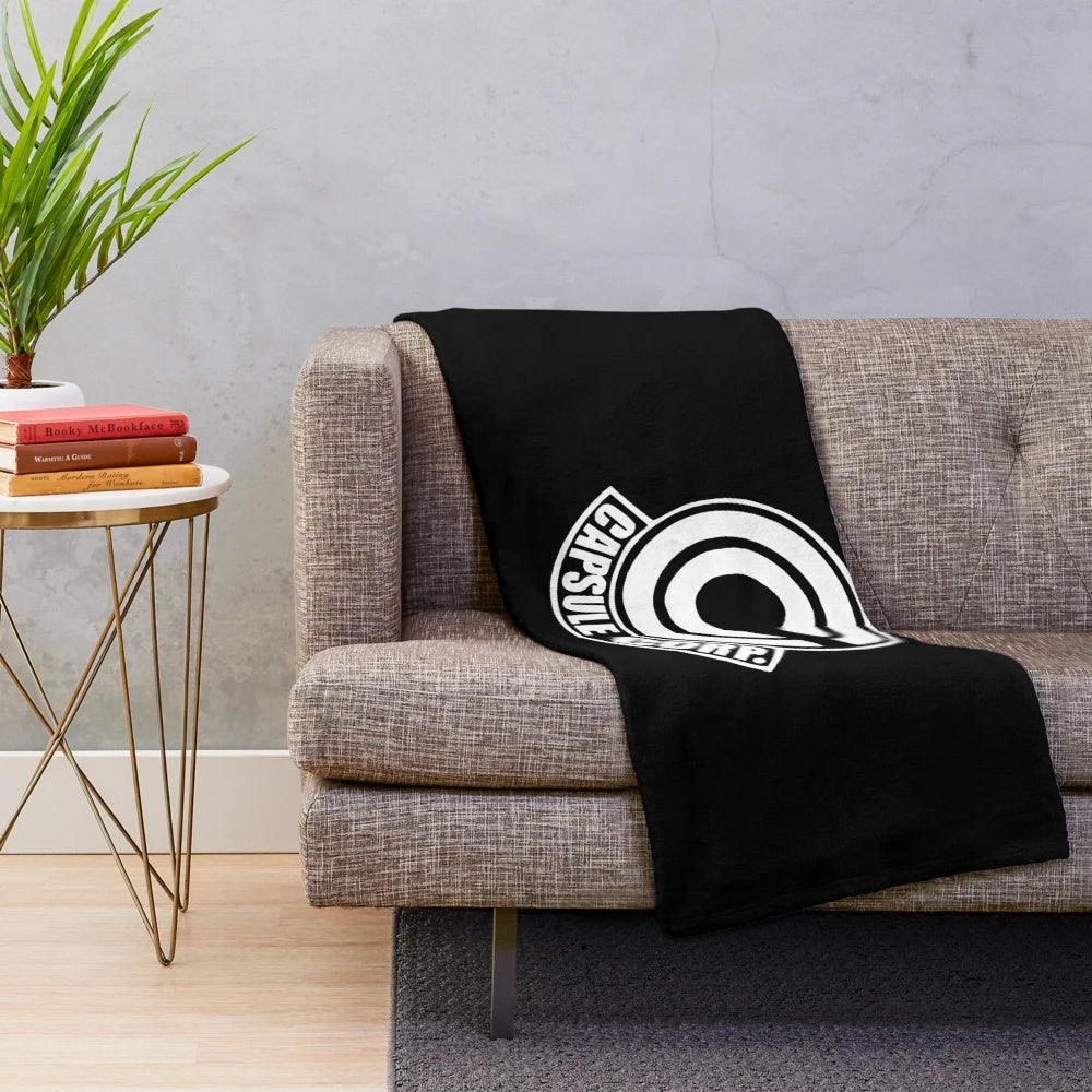 Cozy anime-inspired Capsule Corp Dragon Ball themed plush blanket