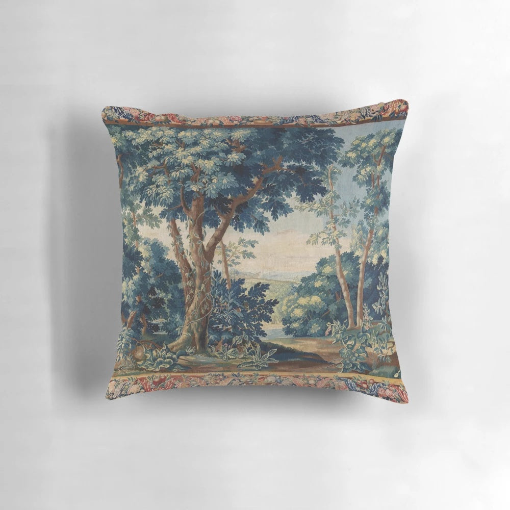 Antique tapestry-inspired pillow with a lush, green woodland landscape design