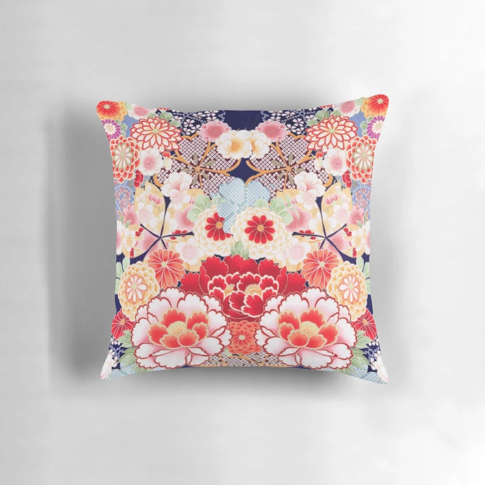 Antique-style floral pillow featuring a vibrant design of Japanese-inspired pink, white, and blue wild roses and peonies.