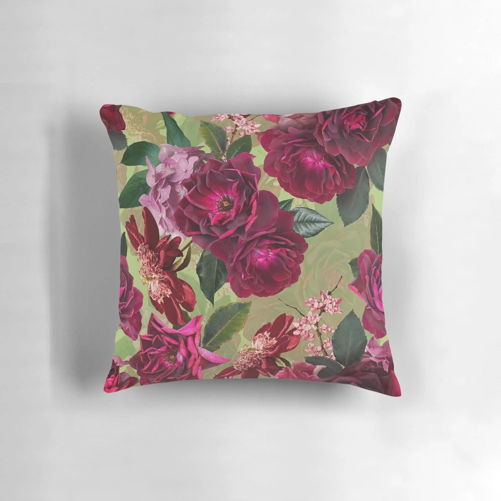 Antique green botanical flower rose pillow with a vintage, mystical pattern for botanical-inspired home decor.