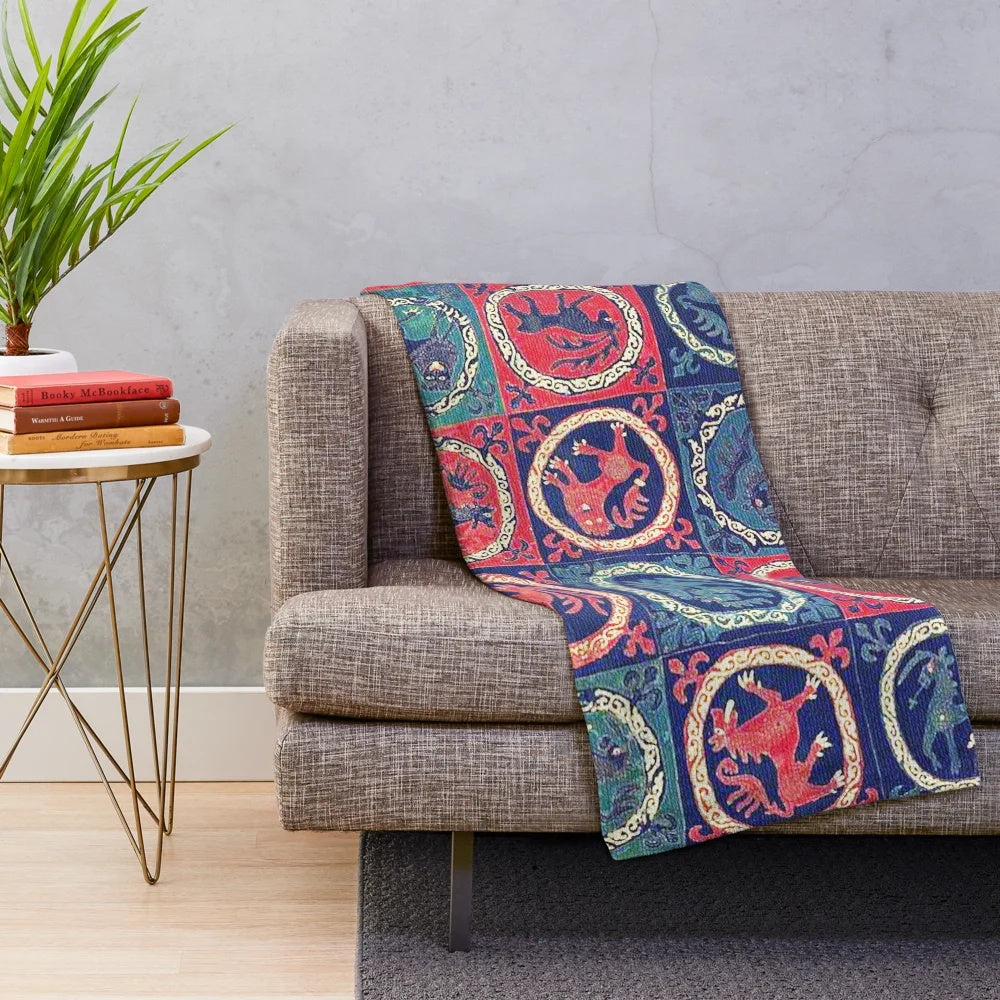 Plush blanket with medieval bestiary design including deer, unicorns, and lions on an antique Scandinavian tapestry-style pattern