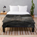 Plush blanket featuring the Egyptian god Anubis and a desert landscape with pyramids