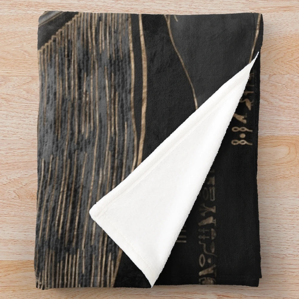 Plush blanket featuring the Egyptian god Anubis and a desert landscape with pyramids