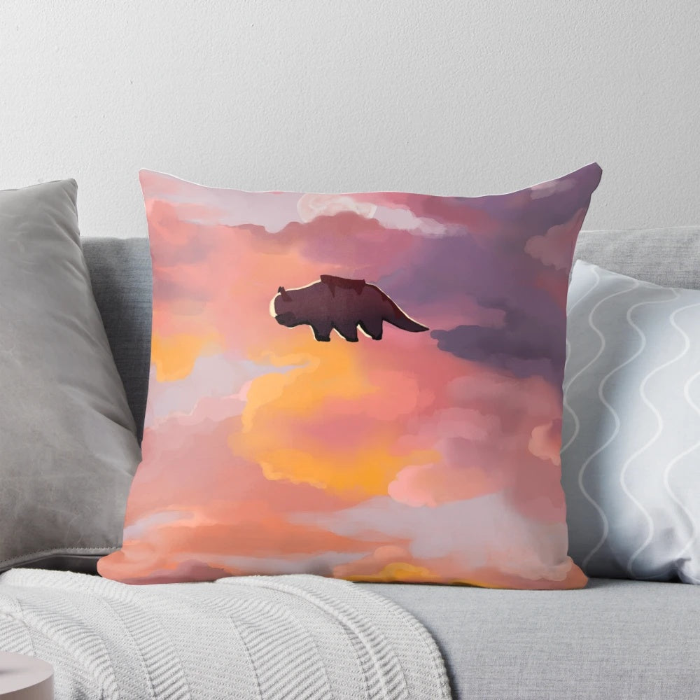 Appa the flying bison from Avatar the Last Airbender depicted in a sunset sky on a decorative pillow