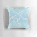 Aqua blue beach-themed pillow with white starfish design