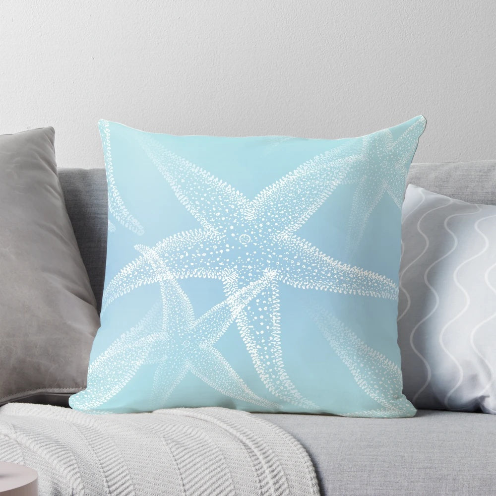 Aqua blue beach-themed pillow with white starfish design